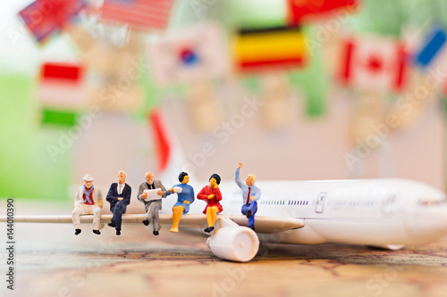 miniature people, travel by plane for travel. using as business background concept.