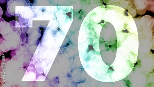 Seventy to seventy one years birthday fade in/out animation with color gradient moving bokeh background. Animation: 90 frames still with number, 180 fade out, 30 clear, 180 fade in, 300 still.
 photo