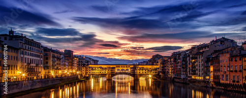 Dramatic dawn over the Ponte Vecchio in Florence photo