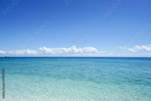 clear blue sea water with bright blue sky