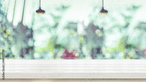 Empty White plank wooden table top with blurred window of coffee shop, Mock up template for display or montage of your design,Banner for advertise of product,panorama view