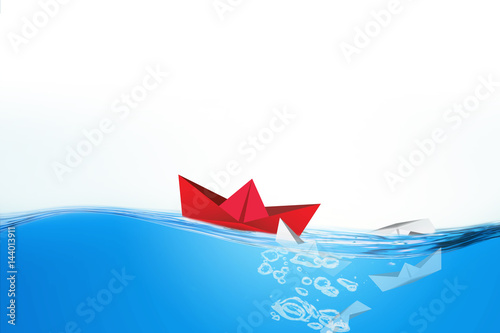 Paper boats sailing, leadership concept

