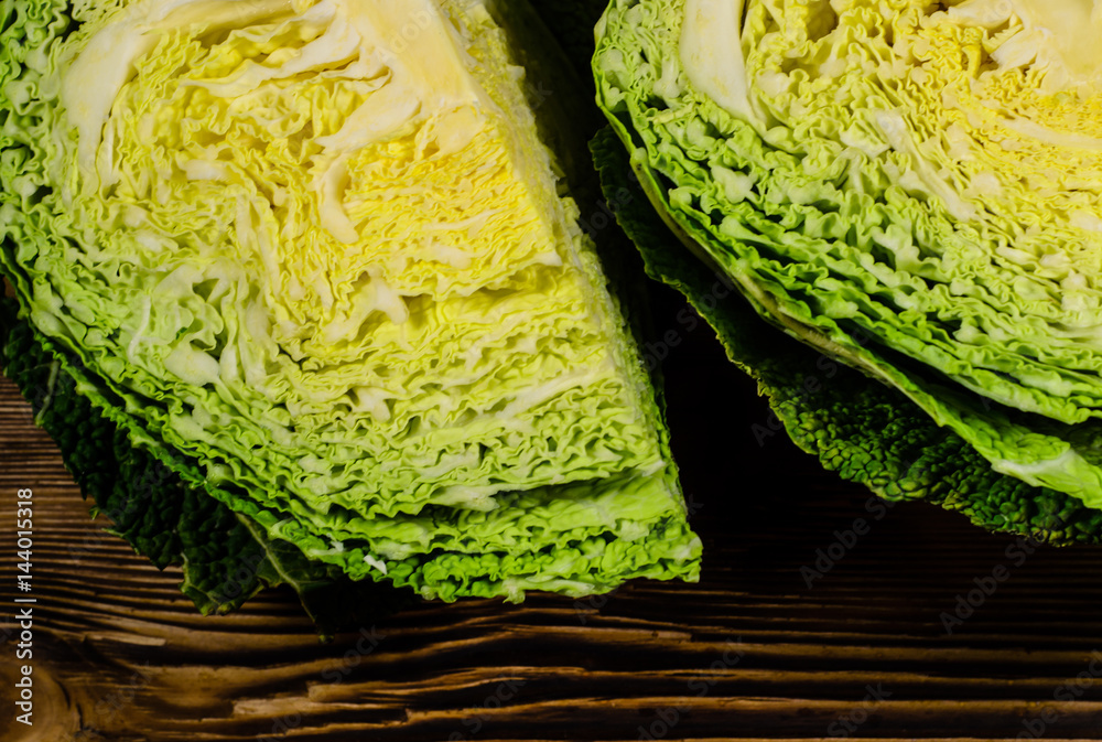 Obraz premium Savoy cabbage on wooden table