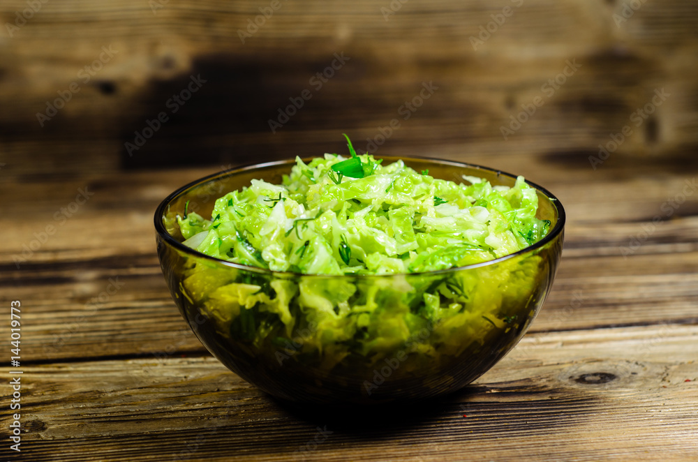 Salad with savoy cabbage and green onion in a bowl Salad with savoy cabbage and green onion in a bowl