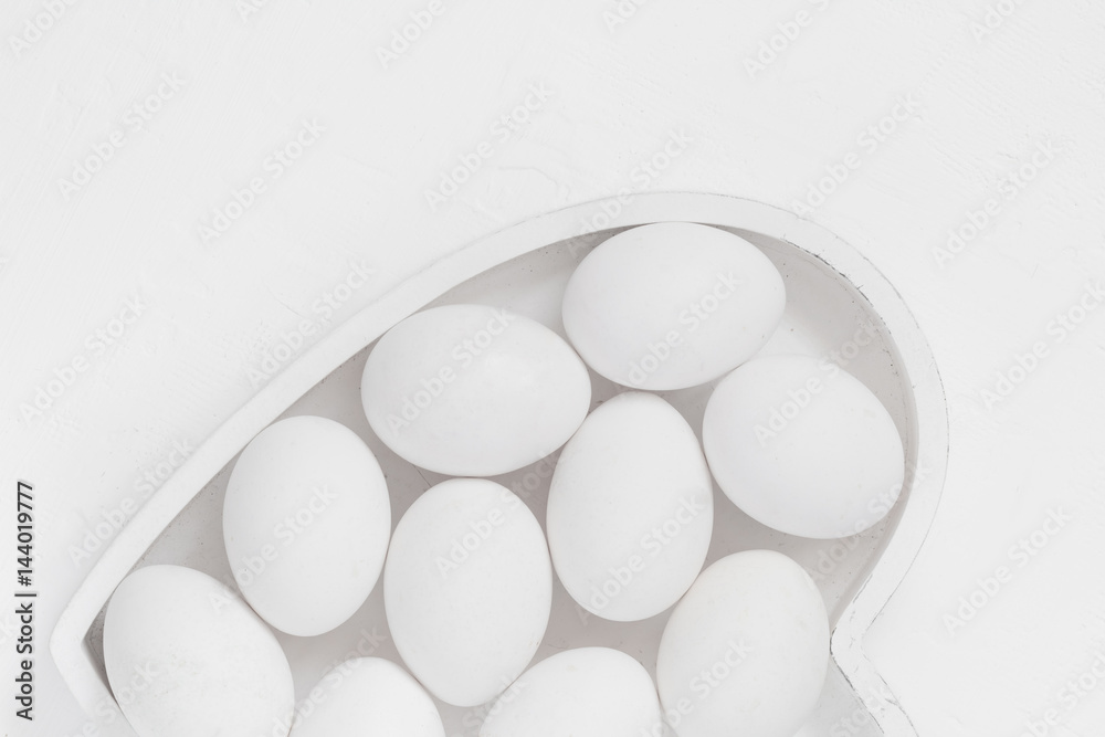 White eggs background Easter heart