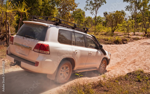 Offroad vehicle driving through dry riverbed. Northern Territories, Australia