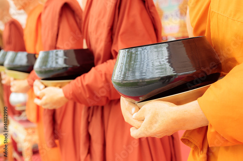 alms bowl on hands buddha statue