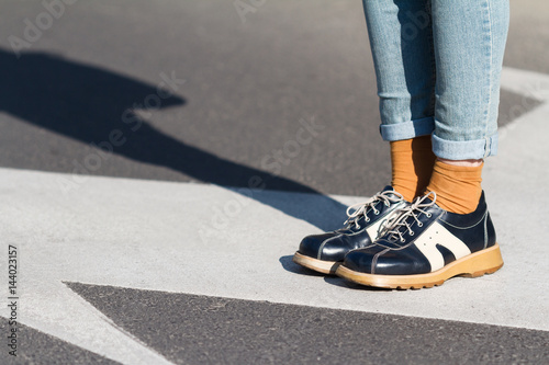 close up of woman shoes standing on the street