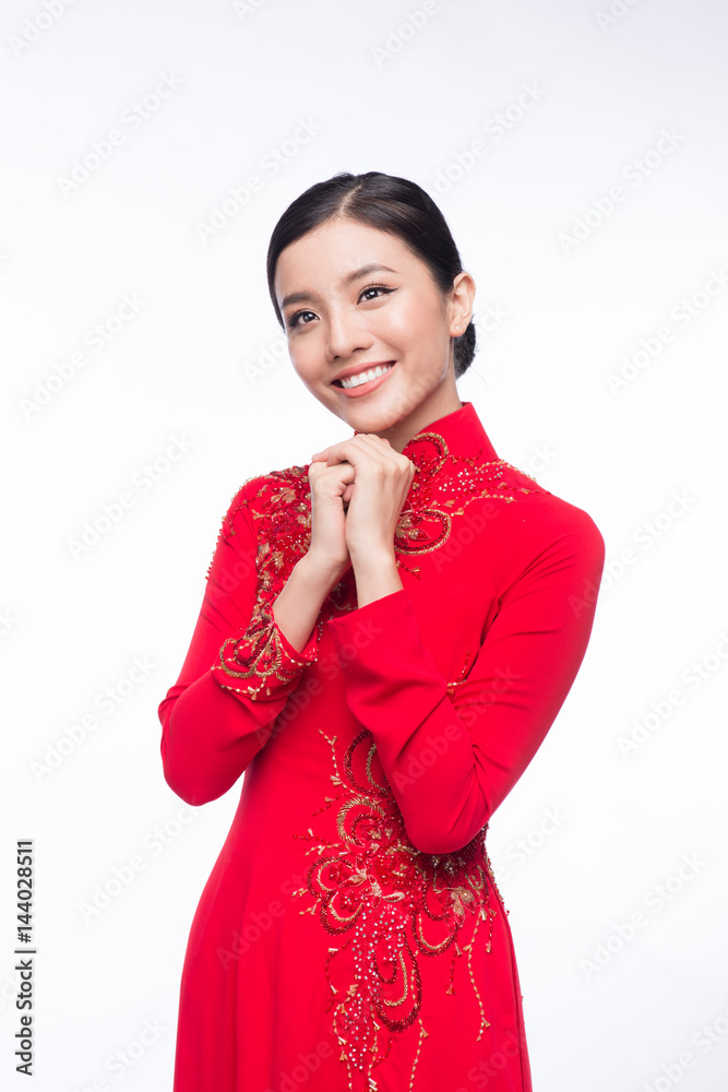 Charming Vietnamese Woman in Ao Dai Traditional Dress, Gesture to Pray or Wishing. Charming Vietnamese Woman in Ao Dai Traditional Dress, Gesture to Pray or Wishing.