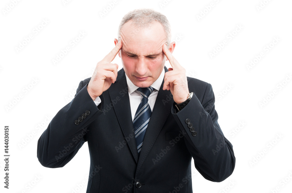 Portrait of senior worker focusing with hands on head Portrait of senior worker focusing with hands on head