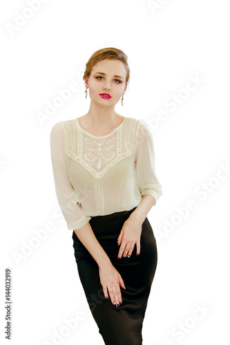 beautiful young girl in a white blouse and black skir