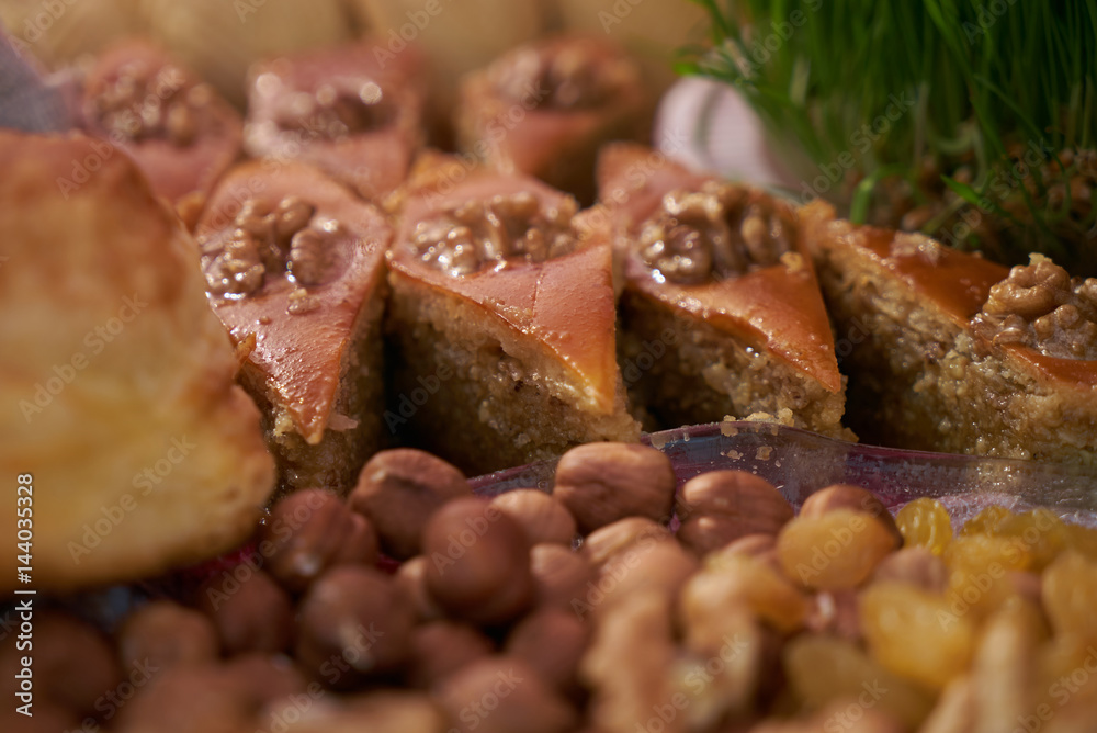 Novruz tray with Azerbaijan national desserts against silk scarf background