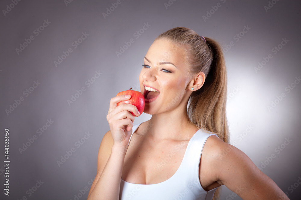 Young sexy girl eating fruits  to your diet
