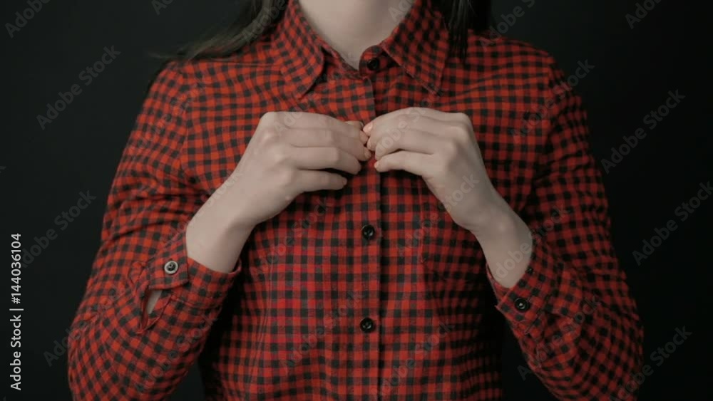 Woman undressing shirt and showing bra Stock Video | Adobe Stock