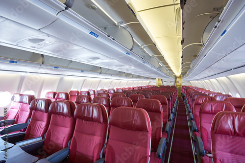 Seat rows in an airplane cabin. Interior of the passenger aircraft.