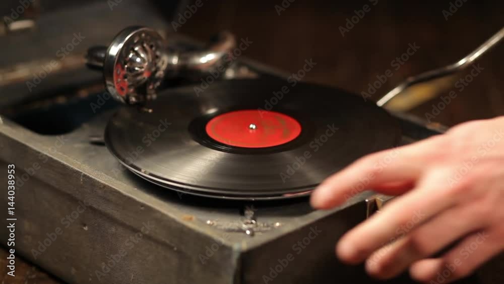 Playing vinyl records on a retro gramophone, potefone Playing vinyl records on a retro gramophone, potefone