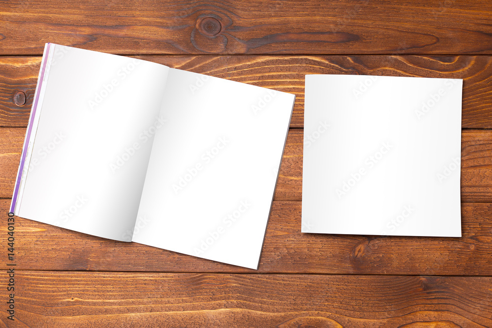 Blank book or magazine cover on wood background Blank book or magazine cover on wood background