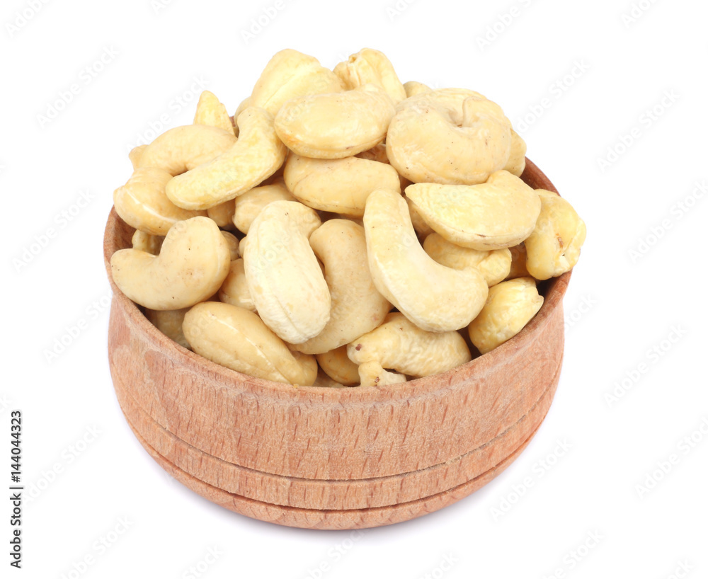 cashew in wood plate isolated on white background cashew in wood plate isolated on white background