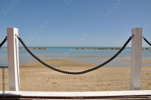 fence and ropes on the beach