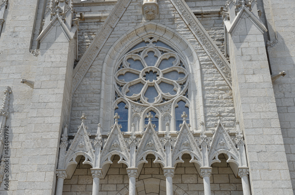 Heart of Jesus church in Barcelona, facade stone tracery details.