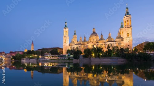 Zoom out timelapse of Zaragoza in a summer sunset