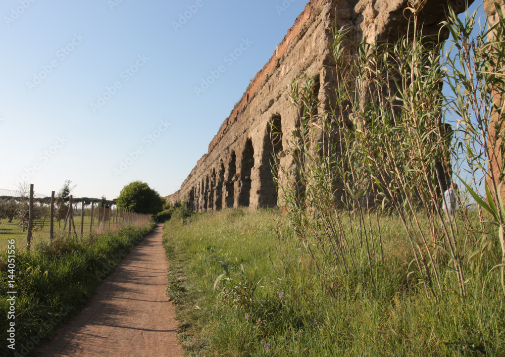 Roman aqueduct Aqua Claudia in the Parco degli Acquedotti public park in Rome, Italy. It is part of the Appian Way Regional Park and is of approximately 240 ha.