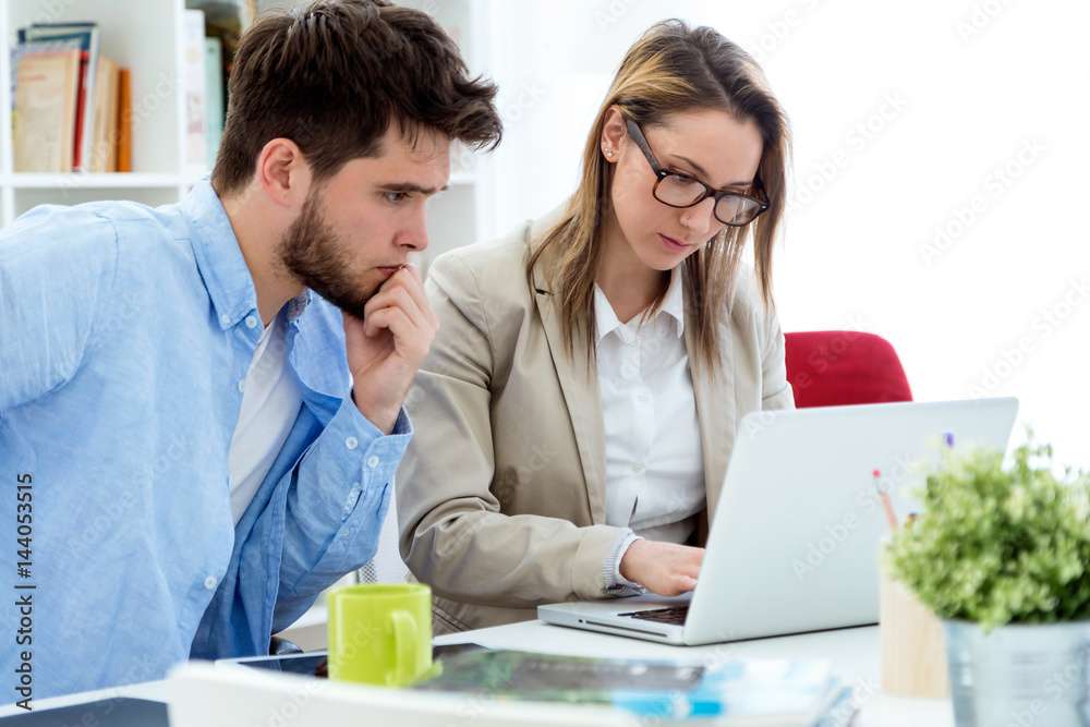 Two entrepreneurs working in the modern office. Two entrepreneurs working in the modern office.