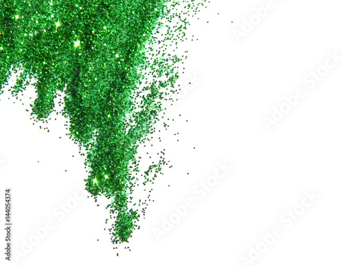 Green glitter sparkles on white background.