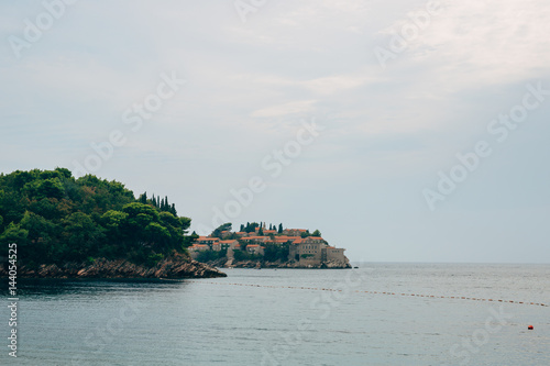 Island of Sveti Stefan close up at sunset. Montenegro, the Adriatic Sea, the Balkans. © Nadtochiy
