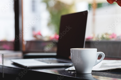 Coffee cup , laptop in coffee shop , business,