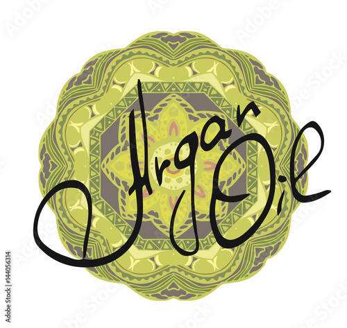 Hand written words Argan Oil on green mandala on white background