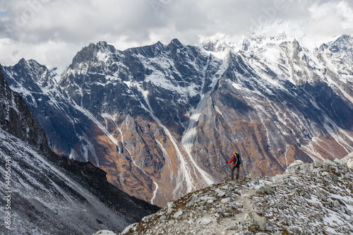 Trekker goes down fron Larke La pass on Manaslu circuit trek in Nepal © Maygutyak
