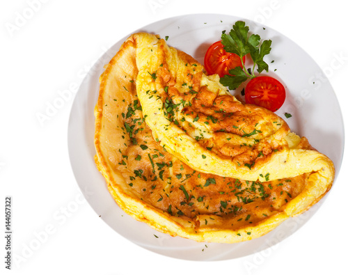omelette in a plate. top view. isolated on white