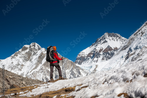 Trekker approaching PumoRi mountain in Khumbu valley on a way to Everest Base camp