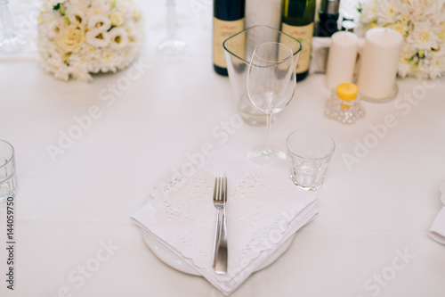 Plates at the wedding banquet. Table setting. Wedding decorations. Wedding at the sea in Montenegro.
