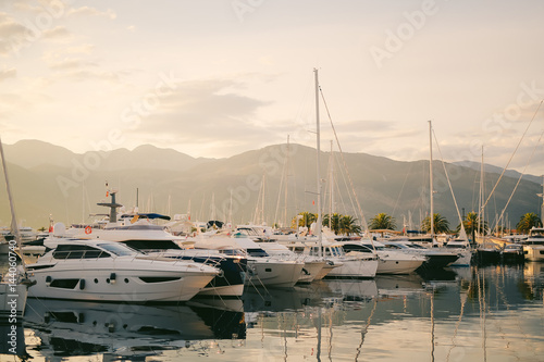 Moored boats in the Bay of Kotor, on the background of the peninsula Lustica in Montenegro. Away from the coast