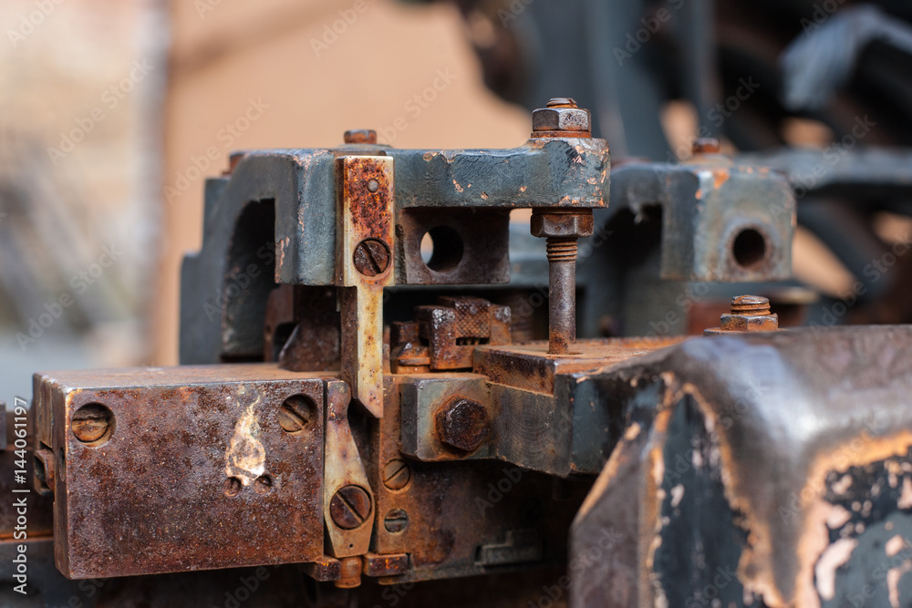 Old rusty printing machine complex mechanism of metal