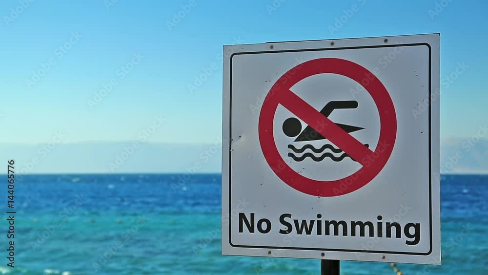 No Swimming plate on the beach. Swimming is forbidden No Swimming plate on the beach. Swimming is forbidden