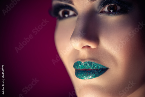Beauty Model Face with Turquoise Makeup