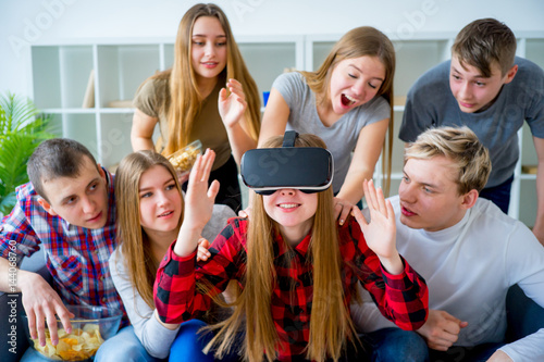 Group of friends playing with VR © Nichizhenova Elena