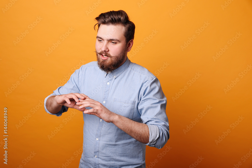 Bearded man tells and gestures Bearded man tells and gestures