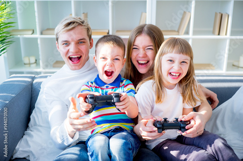 Family playing video games photo
