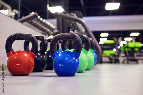 Sports kettlebell  weights on  floor in the gym.