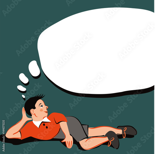Boy lying on the floor and deep in thought