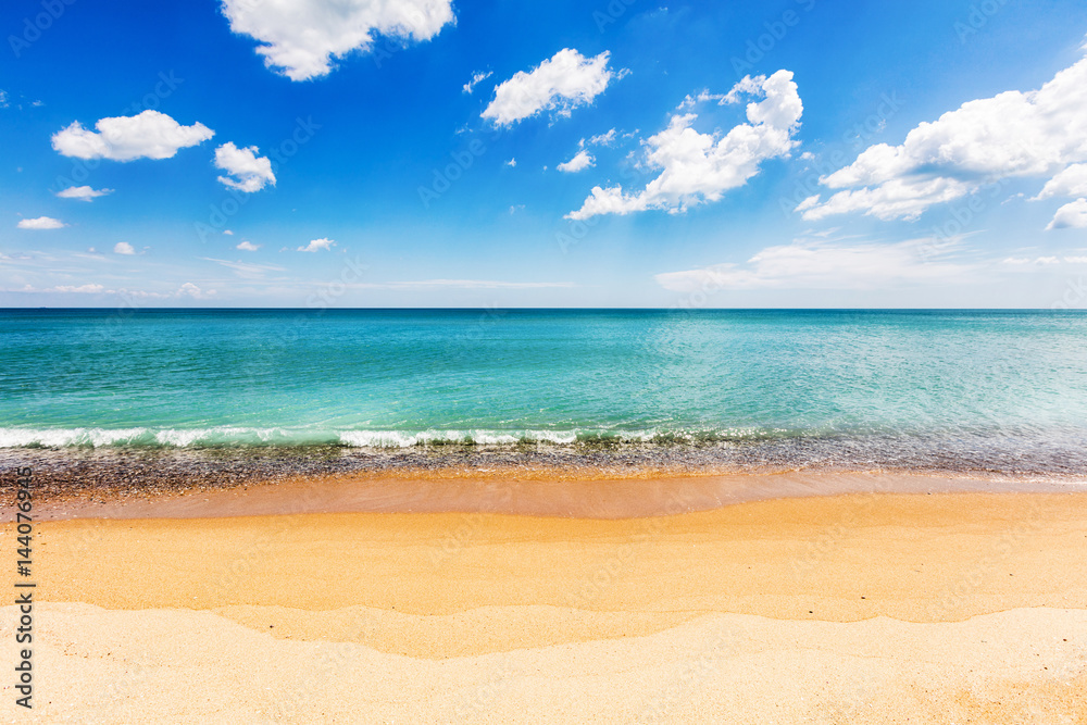 Simple beach view with azure sea and white clouds