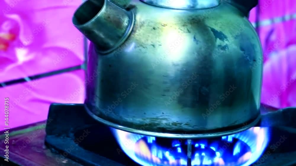 kettle boiling on a gas stove and zoom in kettle boiling on a gas stove and zoom in