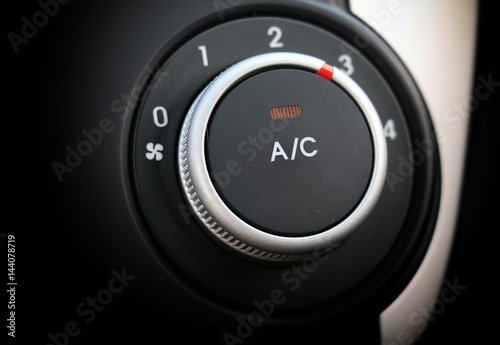 button to turn on the air conditioner