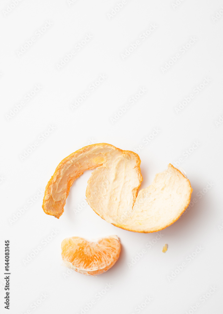 Mandarin slice with rind on white background Mandarin slice with rind on white background