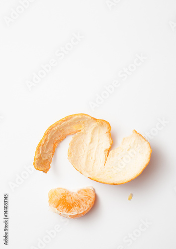 Mandarin slice with rind on white background