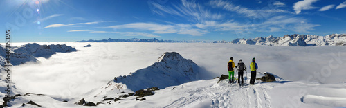 ski mountaineer with sea of clouds, TrÃ©care peack, Valtournenche, Aosta Valley, Italy photo